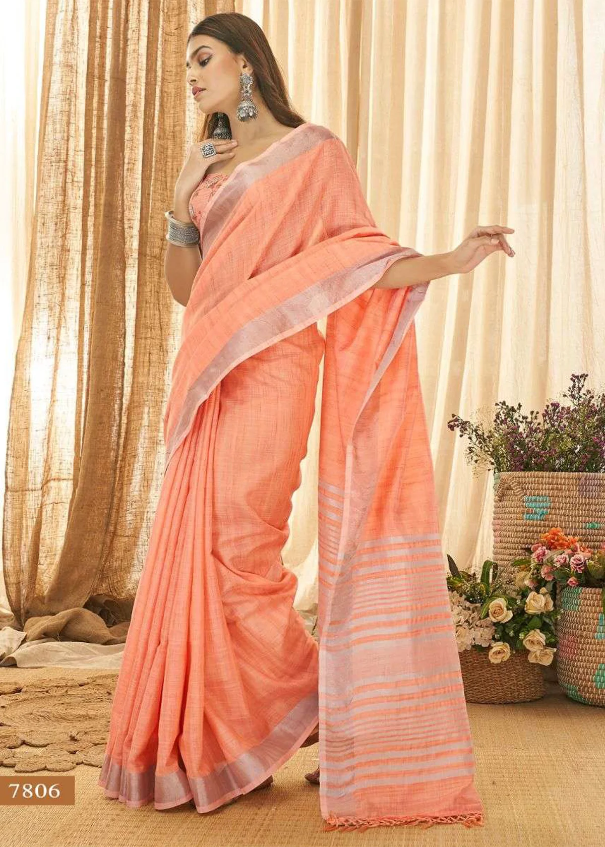 peach color saree with silver blouse