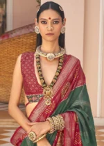 Dark Green Printed Patola Saree with Red Blouse